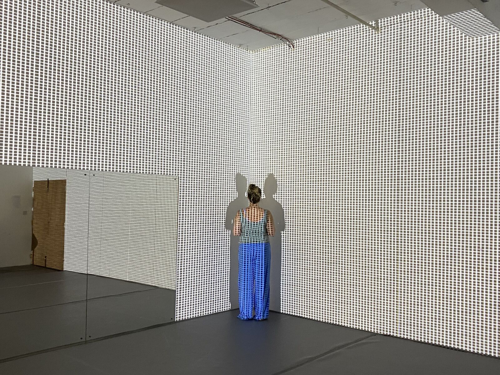 Sinéad O'Kelly R&D — performer against grid projection